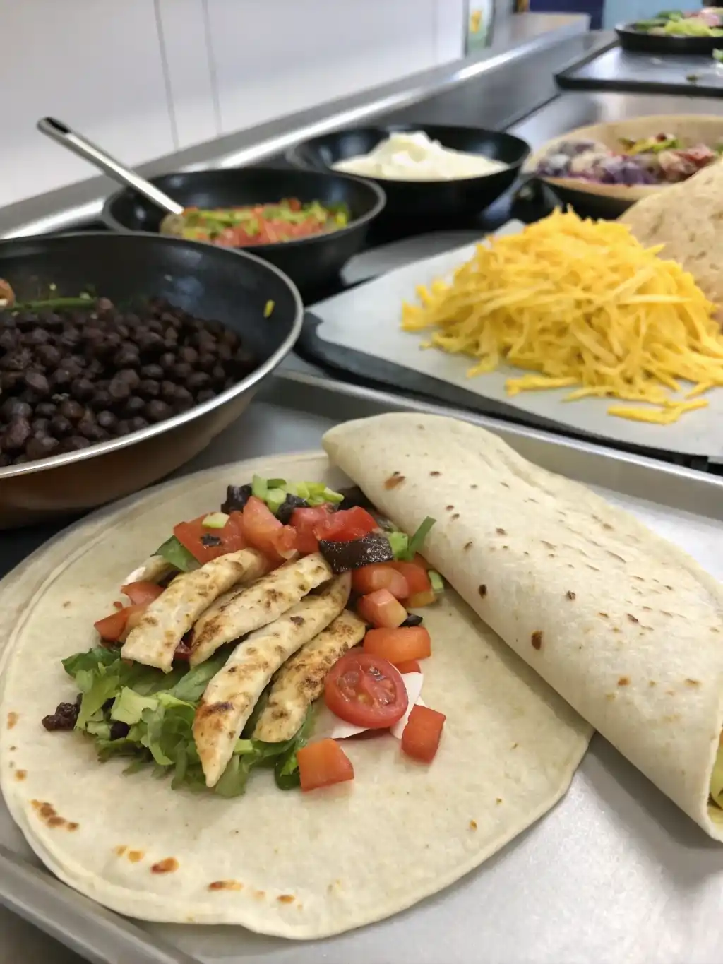 Step-by-Step Burrito Assembly Three-step assembly of a chipotle ranch grilled chicken burrito from tortilla to skillet.