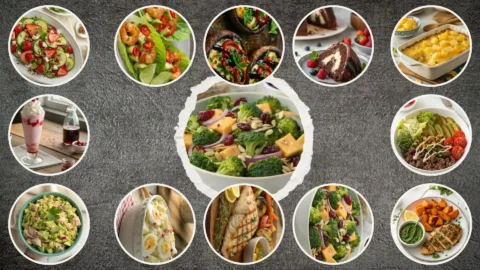 Overhead view of twelve vibrant summer dishes—salads, grilled seafood, shrimp cups, drinks, and peach pie—arranged on a rustic white table in natural light.