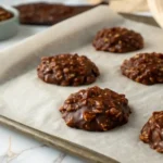 Fudgy No-Bake Chocolate Peanut Butter Cookies cooling on a piece of wax paper.